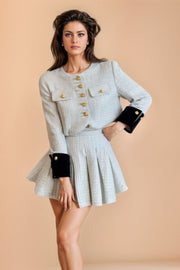 Two-piece tweed blouse and skirt set.