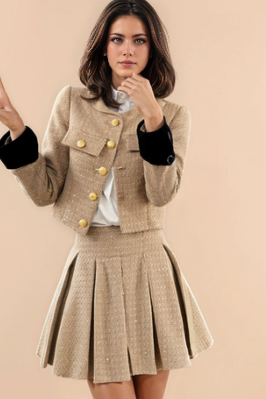 Two-piece tweed blouse and skirt set.