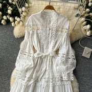 Long dress with embroidery, high neck, flared sleeves with high quality bows