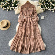 Long dress with embroidery, high neck, flared sleeves with high quality bows