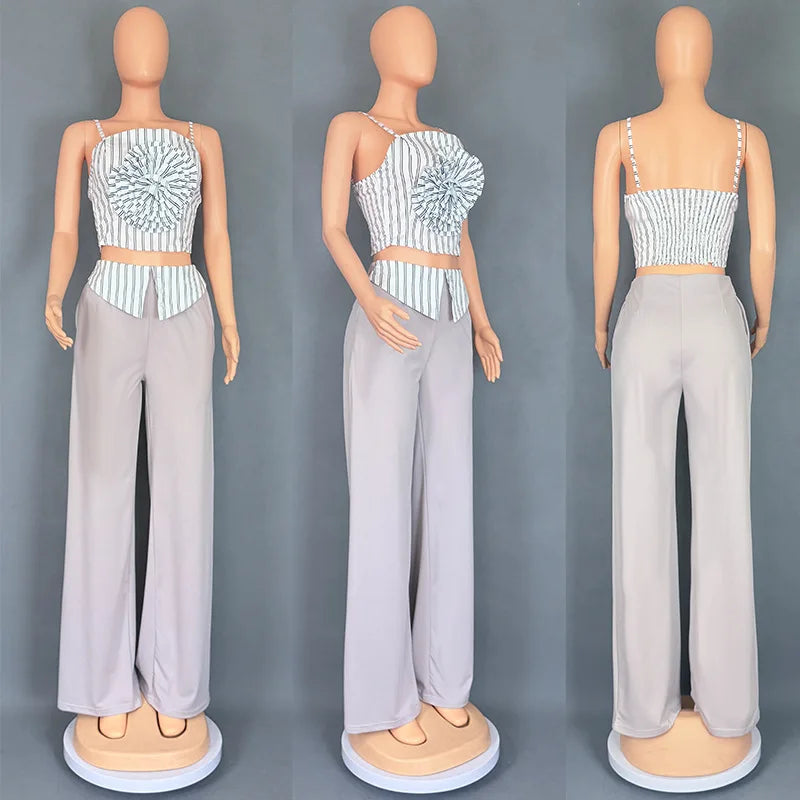 Short two-piece set with striped straps and floral appliqués, wide-legged pants
