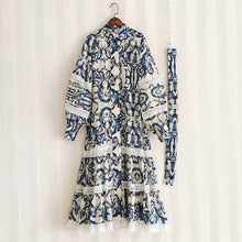 Midi dress with lantern sleeves and pearl buttons with high quality blue floral print