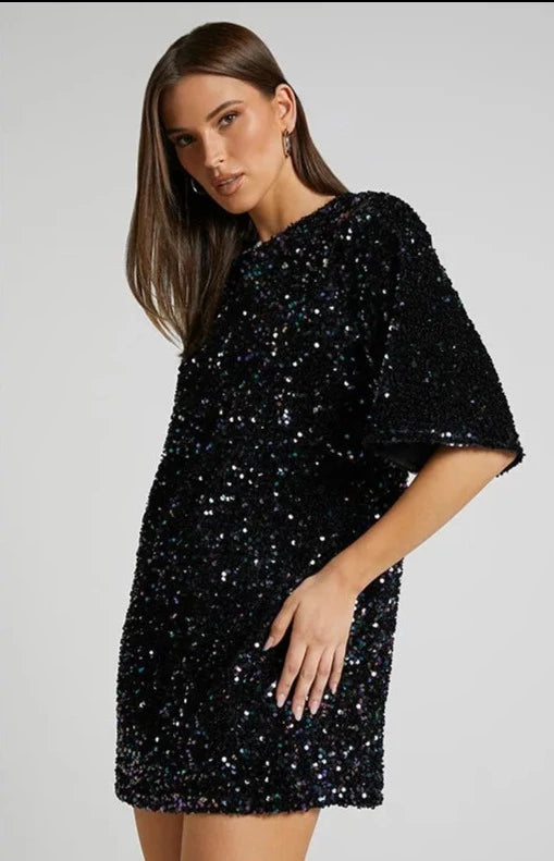 Sequin party dress with round neck and half sleeves provides a classic quality silhouette