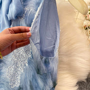Elegant and beautiful women's dress in a vibrant color with heavy embroidered lace and high-quality sparkling sequins.