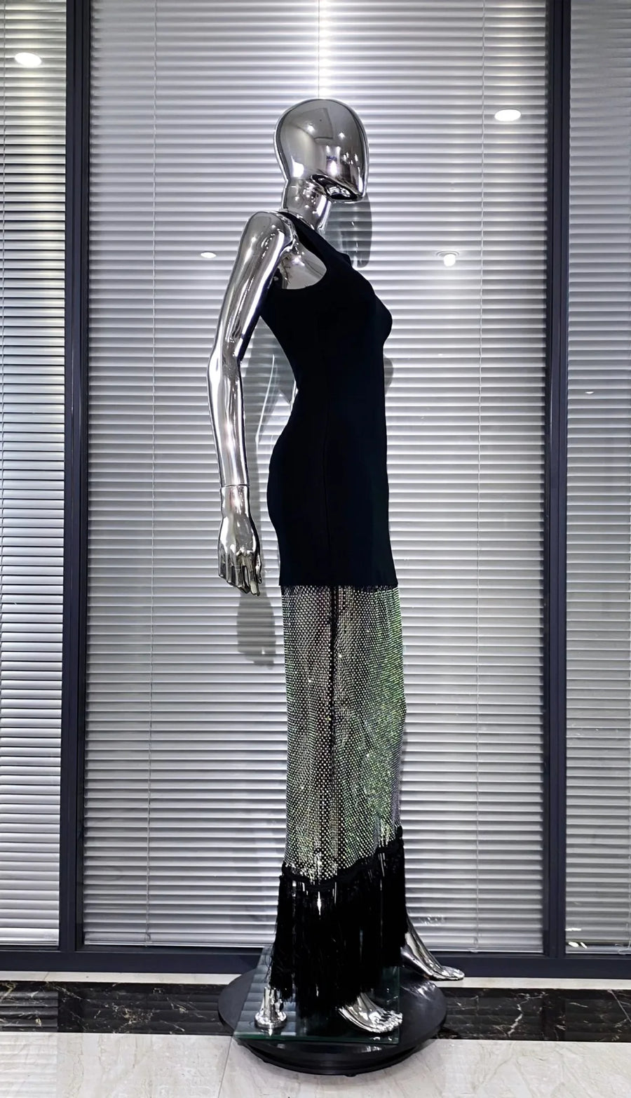 Black bodycon dress with tassel hem and shiny mesh with diamonds
