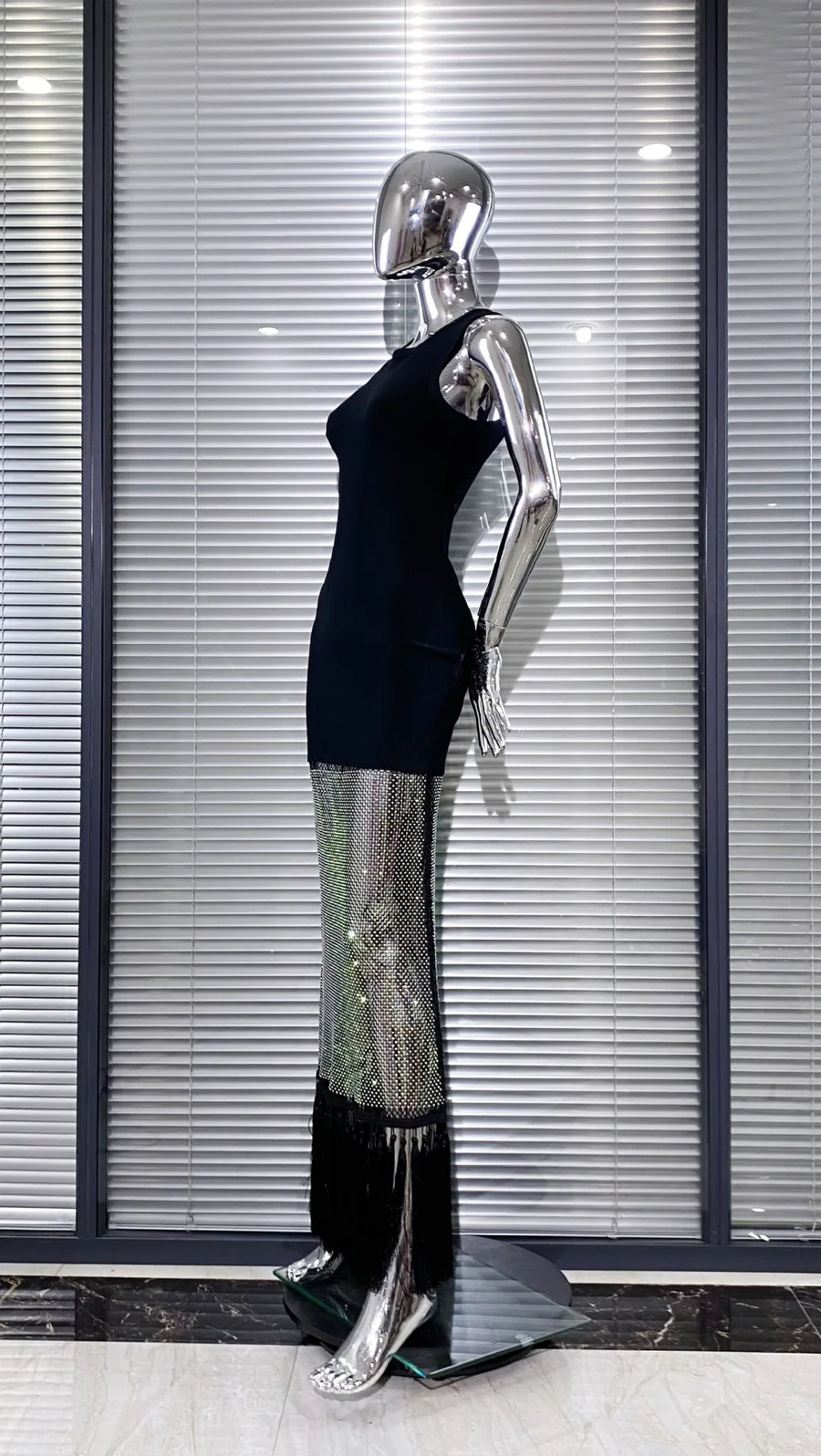 Black bodycon dress with tassel hem and shiny mesh with diamonds