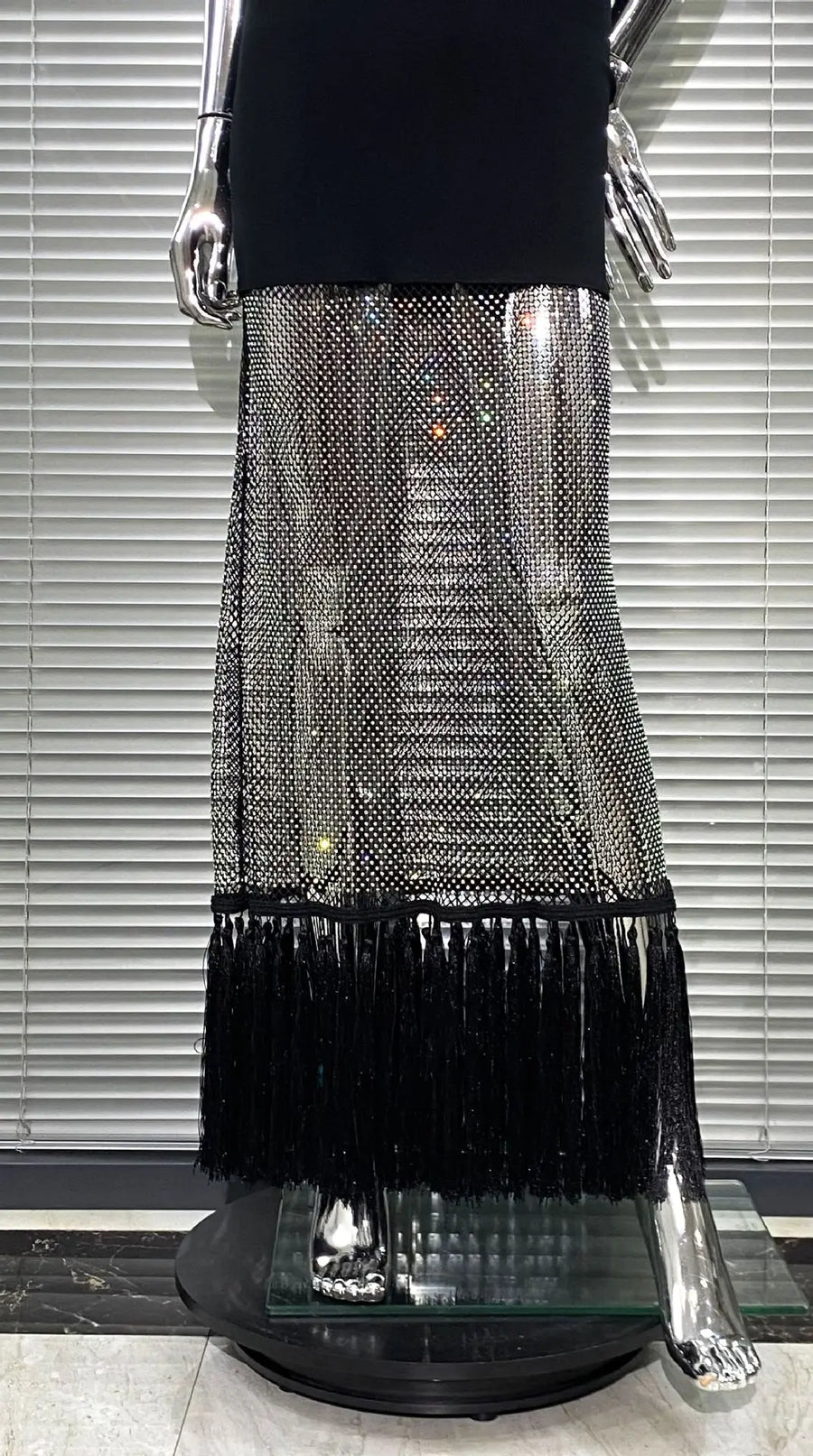 Black bodycon dress with tassel hem and shiny mesh with diamonds