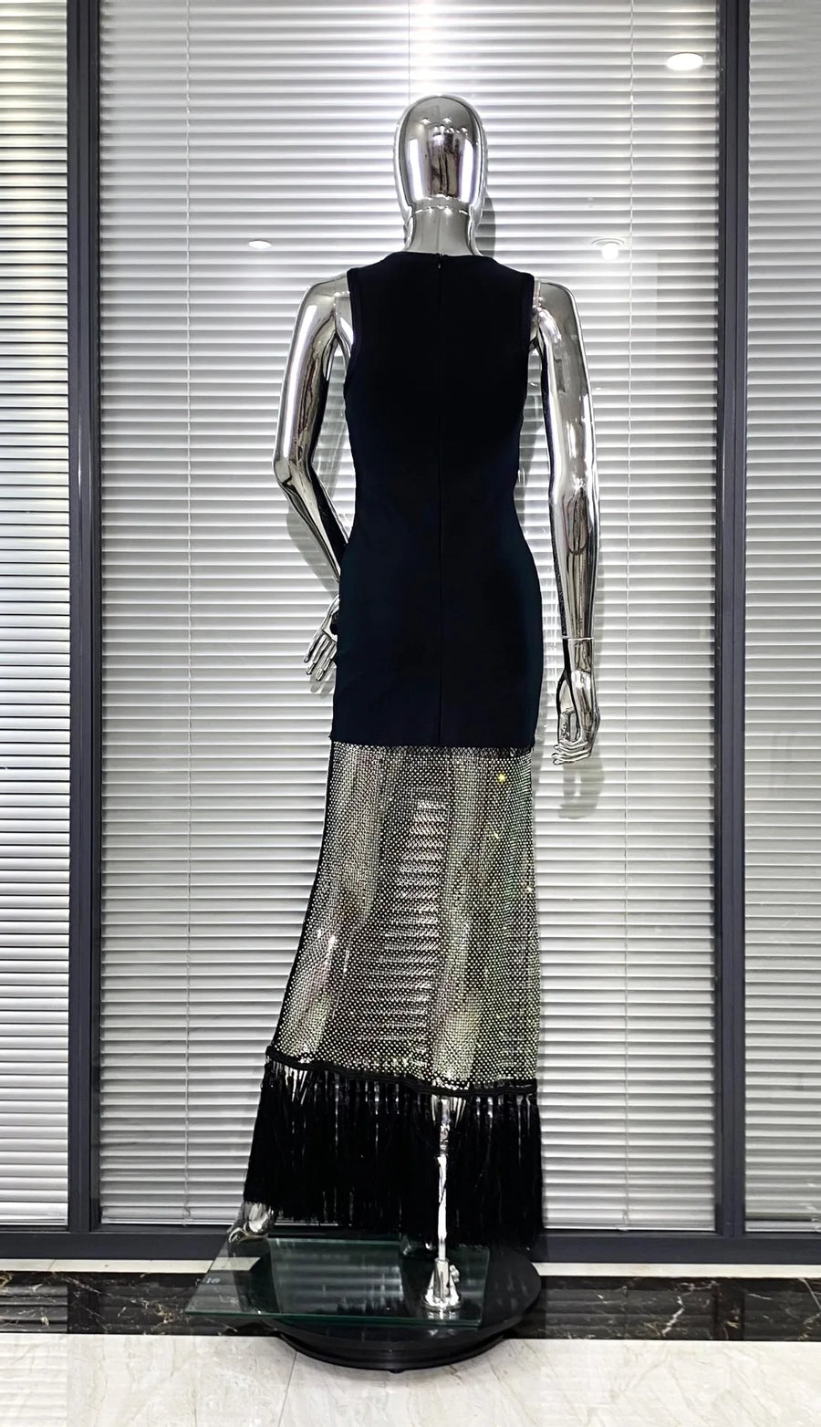 Black bodycon dress with tassel hem and shiny mesh with diamonds