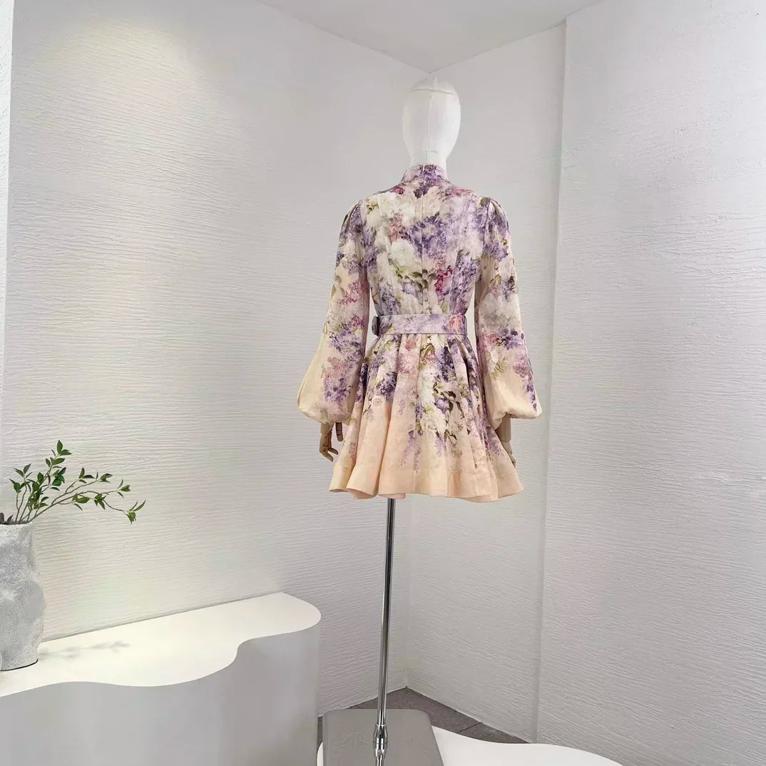 Women's elegant vintage linen dress with a multi-colored floral print, long lantern sleeves, buttons, and A-line silhouette.