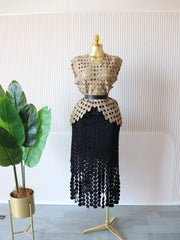 Women's two-piece set, featuring a round neck crop top and a long fitted midi skirt.