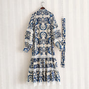 Midi dress with lantern sleeves and pearl buttons with high quality blue floral print