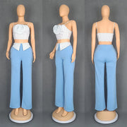 Short two-piece set with striped straps and floral appliqués, wide-legged pants