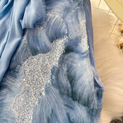 Elegant and beautiful women's dress in a vibrant color with heavy embroidered lace and high-quality sparkling sequins.