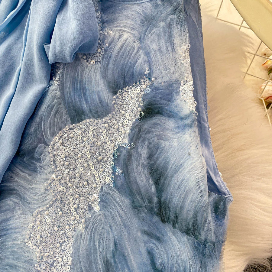 Elegant and beautiful women's dress in a vibrant color with heavy embroidered lace and high-quality sparkling sequins.