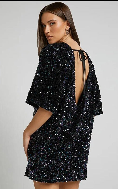 Sequin party dress with round neck and half sleeves provides a classic quality silhouette