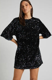 Sequin party dress with round neck and half sleeves provides a classic quality silhouette