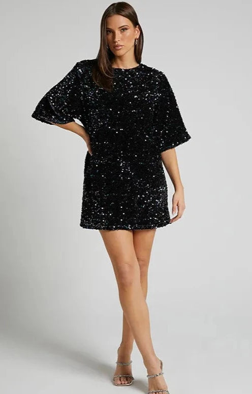 Sequin party dress with round neck and half sleeves provides a classic quality silhouette