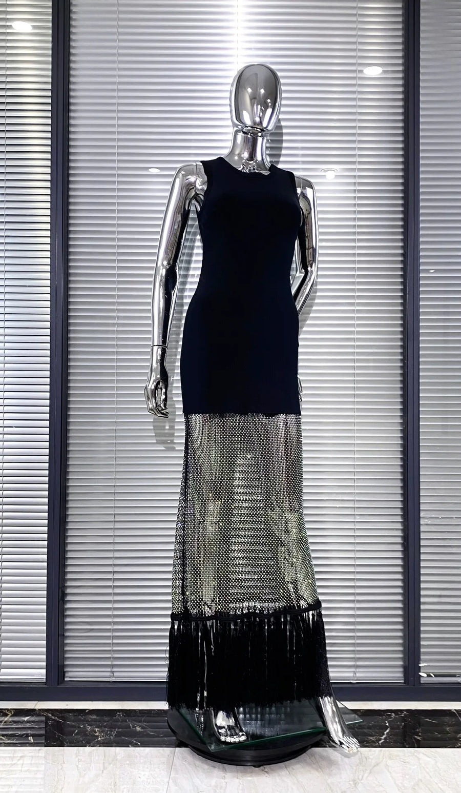 Black bodycon dress with tassel hem and shiny mesh with diamonds