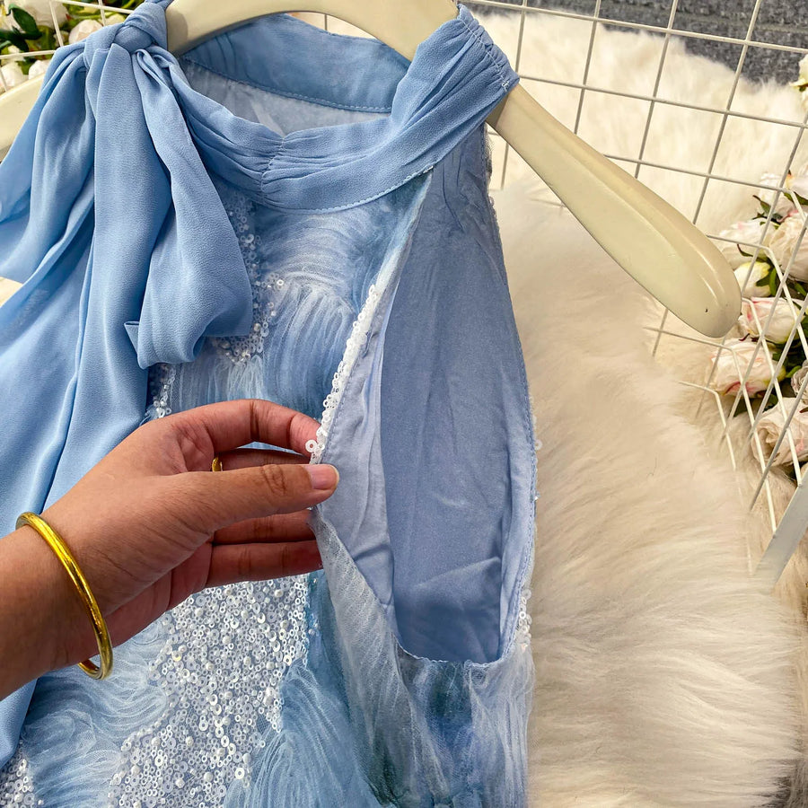 Elegant and beautiful women's dress in a vibrant color with heavy embroidered lace and high-quality sparkling sequins.