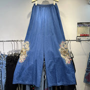 Casual two-piece set: heavy floral denim shirt, loose lapel beaded top, and wide-leg jeans