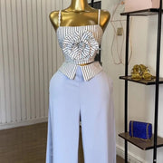 Short two-piece set with striped straps and floral appliqués, wide-legged pants