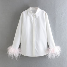 Elegant white long sleeve blouses with feathers on the cuffs