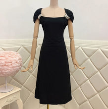 Elegant black midi dress with high quality shoulder detail