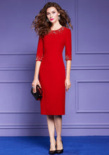 Elegant knee-length dress in red and black with high-quality stone detail