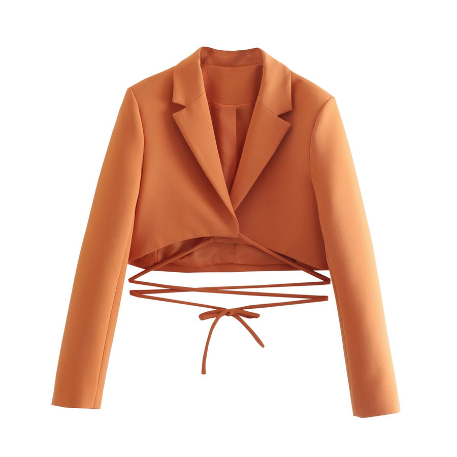 Set of short orange jacket with hem and collar, elegant shorts