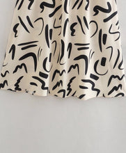Hollow Out Waist Flare Skirt Graffiti Print Strapless Tops Set