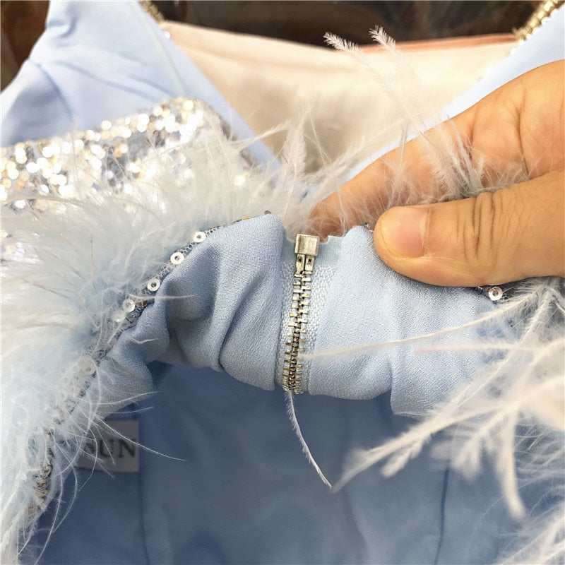 Short blouse with sequins and feathers in various colors