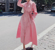 Pink dress with collar long sleeves with pocket on the sides and high quality bow