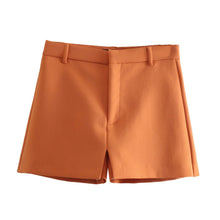 Set of short orange jacket with hem and collar, elegant shorts